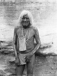 Loinclothed hobby; Obrzek dne - the picture od the day - awa rel - Hopi Priest with bag of sacred meal for the Flute Dance Ceremony at the pueblo of Walpi, Arizona