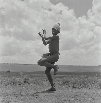 Creator:  Larrabee; Constance Stuart; 1914-2000; Produced:  1941 Phys. Descri  negative : b&w ; 6 x 6 cm. (silver gelatin). photographic print : b&w ; 8 x 10 in. (dupe print).; Subject Geog  South Africa Lesotho   Subjects:  Sotho (Basuto)  Form/Genre  Photographic prints; EEPA 1998-062657; [Summary:  Sotho Herd Boy; 1941. Photographic image of a boy jumping in mid-air. He is wearing a hat and loincloth. Photograph by Constance Stuart Larrabee; 1941. Constance Stuart took photographs in Basutoland (now Lesotho) during her first trip in 1941. In 1947; she returned to Lesotho as an officially accredited photographer. She documented a visit of the British royal family: King George VI; Queen Elizabeth and their daughters Princess Elizabeth and Margaret; to this British Protectorate. She used the occasion to venture into the countryside and captured unique images of rural life among the Sotho people. 
 